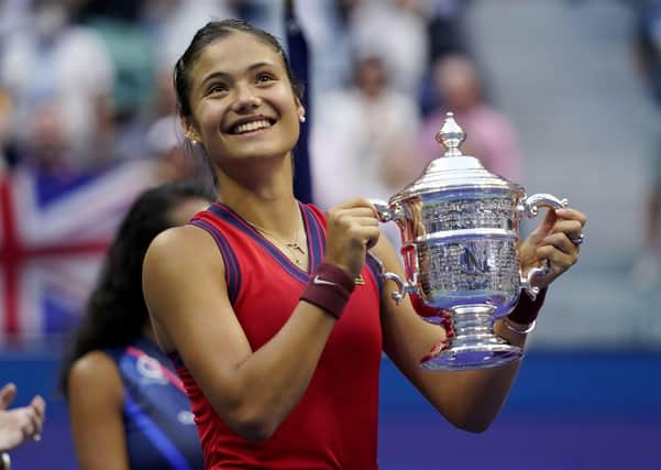 Emma Raducanu holds up the US Open championship trophy after defeating Leylah Fernandez in the women's final in New York Picture: AP/Seth Wenig