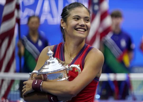 Emma Raducanu holds the US Open championship trophy after defeating Leylah Fernandez in the women's final in New York Picture: AP/Seth Wenig