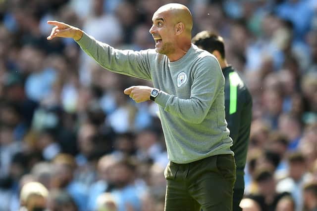 ADMIRER: Manchester City boss Pep Guardiola, above, reportedly wants to sign Leeds United and England star Kalvin Phillips. Photo by OLI SCARFF/AFP via Getty Images.