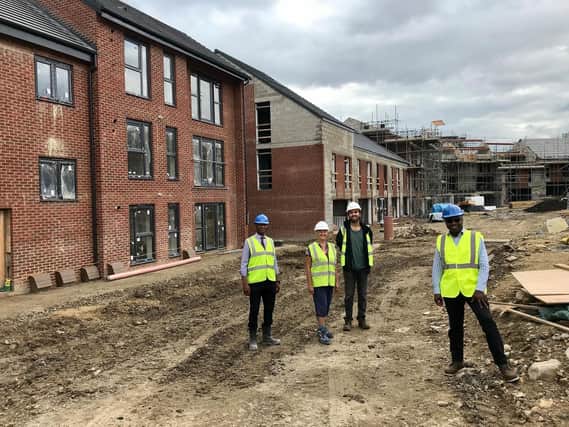 Pictured (right to left)  Cedric Boston, Unity Interim Chief Executive at the Leopold Street development in Leeds with Yoseph Ahmed, prospective member, ChaCo; Alison Phelps, Neighbourhood Task Group, ChaCo, and Wayne Noteman, Unity Regeneration Director.