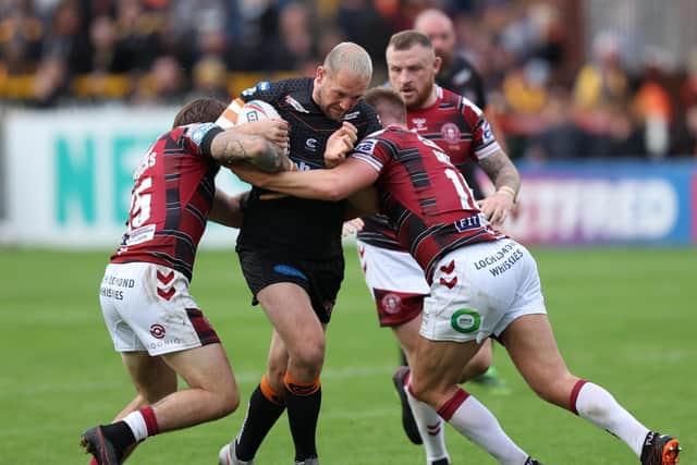 Castleford Tigers prop Liam Watts charges forward against Wigan Warriors, playing on with his shinbone chipped. (JOHN CLIFTON/SWPIX)