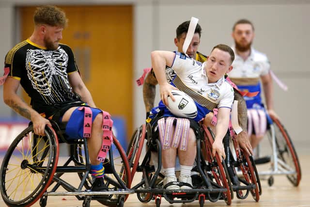 TREBLE HUNT: Leeds Rhinos' Nathan Collins battles with Argonauts Skeleton Army's Fred Nye in the Wheelchair Challenge Cup Final. Picture by Ed Sykes/SWpix.com