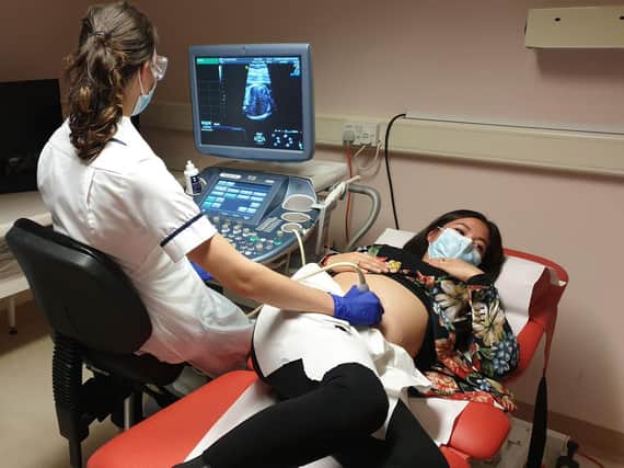 A sonographer at work