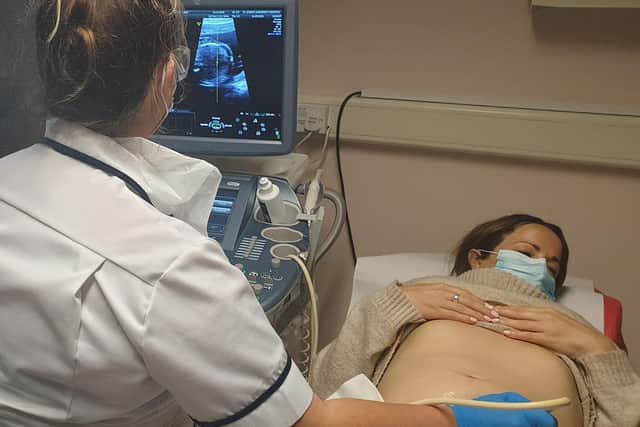 A sonographer at work.