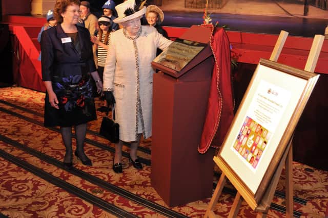 The Queen unveils a plaque in the reopened and restored Leeds City Varieties during her visit to the city in July 2012. PIC: Tony Johnson