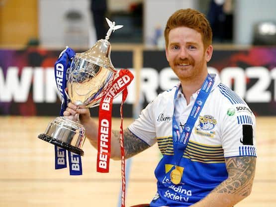 Rhinos' James Simpson with the Wheelchair Challenge Cup. Picture by Ed Sykes/SWpix.com.