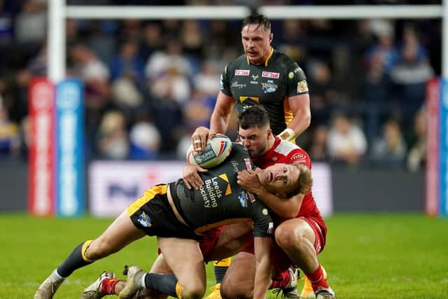 Leeds Rhinos' Brad Dwyer is tackled by Hull Kingston Rovers' Matthew Storton (Picture: PA)
