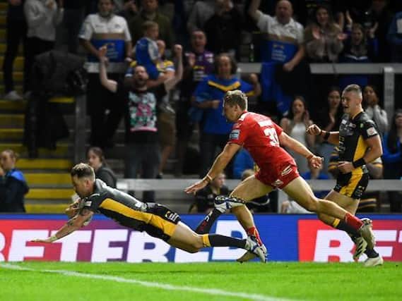 Richie Myler dives over to score for Rhinos. Picture by Will PalmerSWpix.com.