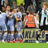 FALSE HOPE: Leeds United looked on course for victory after taking the lead through Raphinha's strike at Newcastle United, pictured celebrating the goal above, but the Whites had to settle for a 1-1 draw. Picture by Bruce Rollinson.