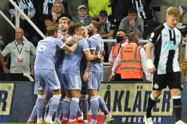 FALSE HOPE: Leeds United looked on course for victory after taking the lead through Raphinha's strike at Newcastle United, pictured celebrating the goal above, but the Whites had to settle for a 1-1 draw. Picture by Bruce Rollinson.