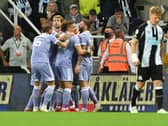 FALSE HOPE: Leeds United looked on course for victory after taking the lead through Raphinha's strike at Newcastle United, pictured celebrating the goal above, but the Whites had to settle for a 1-1 draw. Picture by Bruce Rollinson.