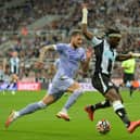 RAPID: Newcastle United winger Allan Saint-Maximin, right, is chased by Leeds United captain Liam Cooper, left, in Friday night's 1-1 draw at St James' Park. Photo by Bruce Rollinson.