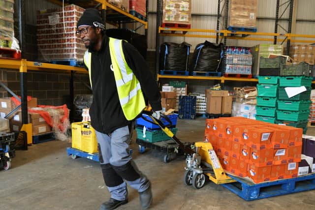 Jason Williams prepares one of the delivery trucks at Fare Share in Holbeck. Picture:Jonathan Gawthorpe.