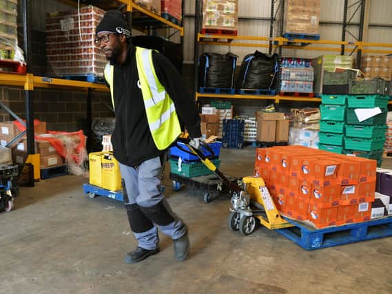 Jason Williams prepares one of the delivery trucks at Fare Share in Holbeck. Picture:Jonathan Gawthorpe.