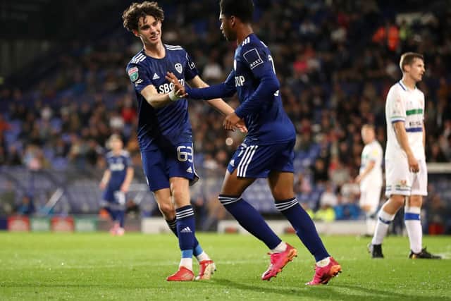 MAKING THEIR MARK: Amari Miller, centre, set up by Archie Gray, left, put a very young Leeds United Academy side on the scoresheet in Tuesday evening's clash at Tranmere Rovers. Photo by Lewis Storey/Getty Images.