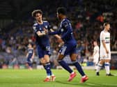MAKING THEIR MARK: Amari Miller, centre, set up by Archie Gray, left, put a very young Leeds United Academy side on the scoresheet in Tuesday evening's clash at Tranmere Rovers. Photo by Lewis Storey/Getty Images.