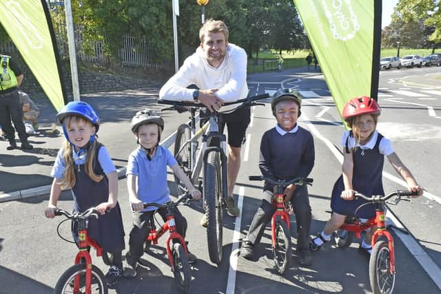 Leeds United's Patrick Bamford opens the new cycle lane with children Beeston Hill St Luke's Primary School (photo: Steve Riding).