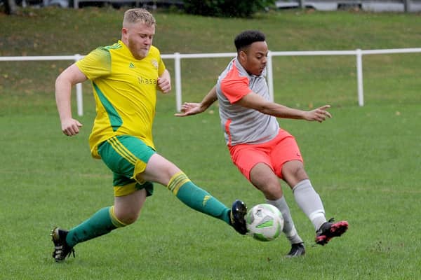 Chapeltown's Tyler Bussue scores his first goal past Colton defender George Walker. Picture: Steve Riding.