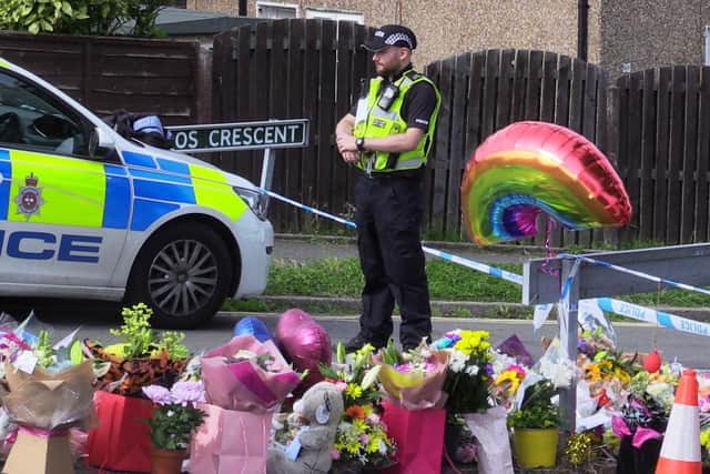 Flowers near to the scene in Chandos Crescent, Killamarsh, near Sheffield, where the bodies of John Paul Bennett, 13, Lacey Bennett, 11, their mother Terri Harris, 35, and Lacey’s friend Connie Gent, 11, were discovered at a property on Sunday morning. Picture date: Tuesday September 21, 2021.
PA