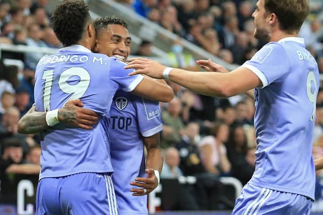 OPPORTUNITY MISSED: Rodrigo, left, goalscorer Raphinha, centre, and Patrick Bamford, right, celebrate as Leeds United go ahead at Newcastle United, only to be pegged back to 1-1. Photo by LINDSEY PARNABY/AFP via Getty Images.