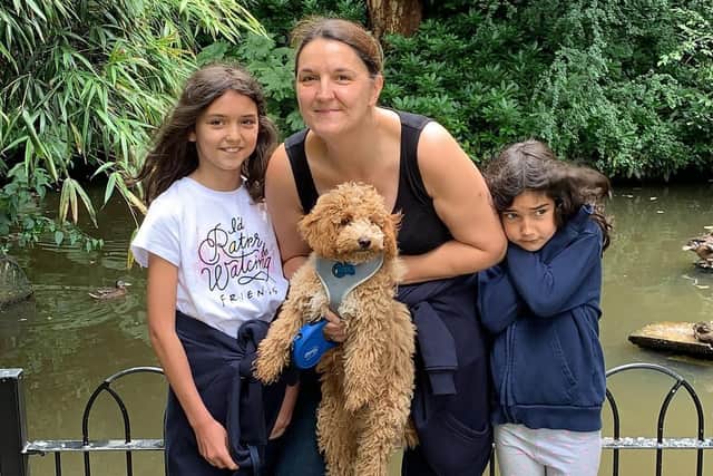 Sarah Cardwell on a day out with her daughters Lucy, 10 and Ellie, seven, and Milo the dog.