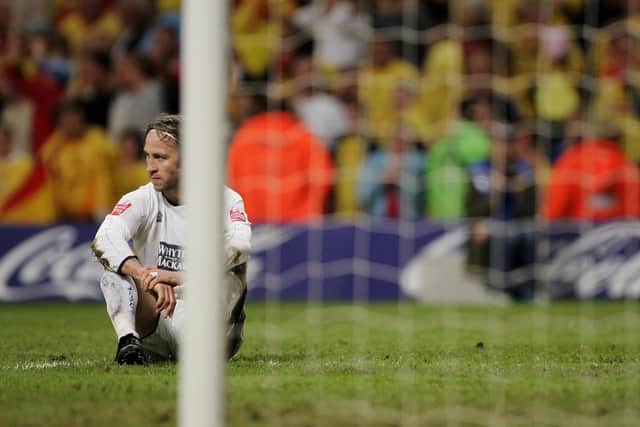 A dejected Shaun Derry sits on the pitch after conceding a penalty during the Championship play-off final against Watford at the Millennium Stadium in May 2006. PIC: Getty