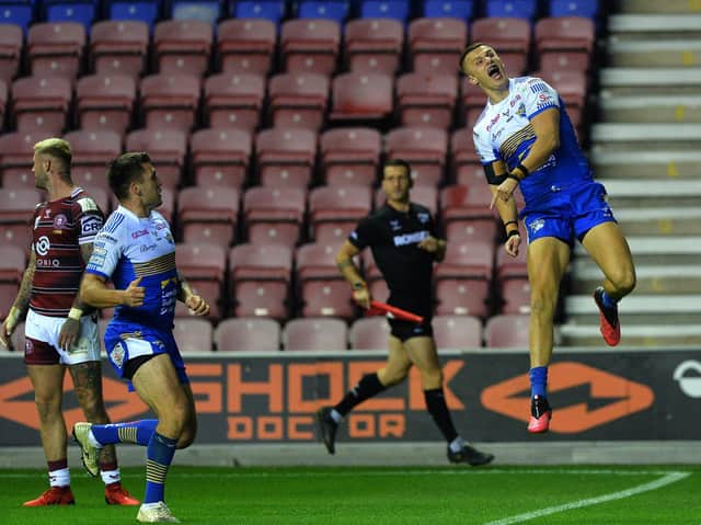 Ash Handley jumps for joy after scoring the only try in Rhinos' play-off win at Wigan. Picture by Jonathan Gawthorpe.