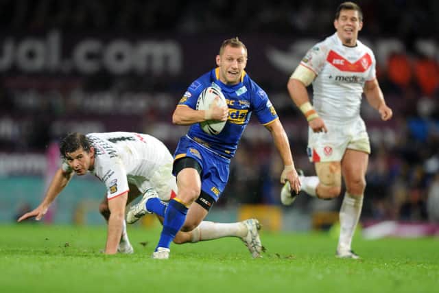 Rob Burrow breaks away to score a sensational solo try in the 2011 Grand Final. Picture by Steve Riding.