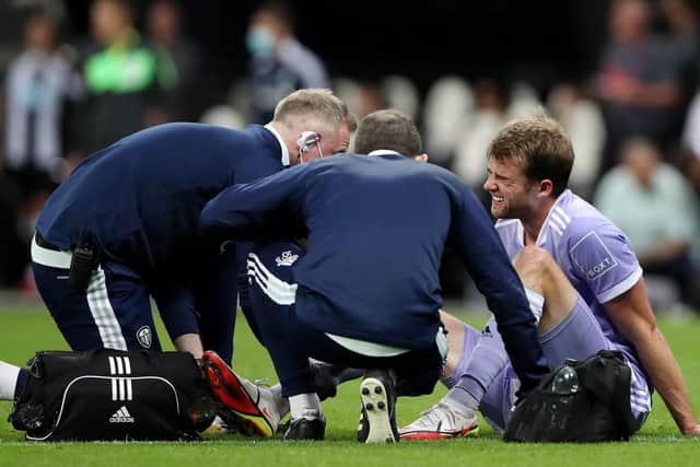 Bamford receives treatment at St James' Park. Pic: Ian MacNicol/Getty