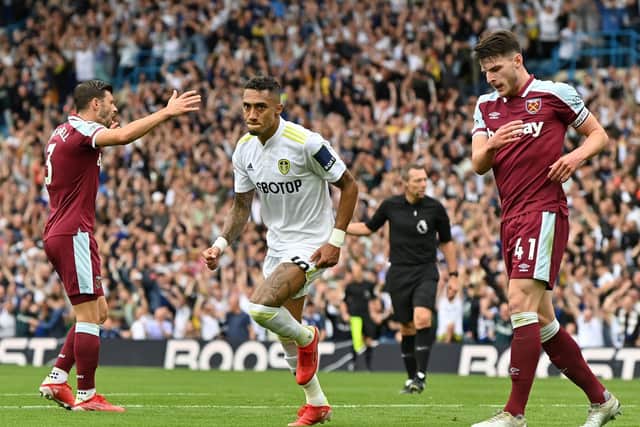 BREAKTHROUGH: Raphinha races away to celebrate after firing Leeds United ahead against West Ham at a packed Elland Road. Picture by Bruce Rolinson.