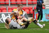 Tashan Gaines scores Rhinos' opening try. Picture by Paul Currie/SWpix.com.