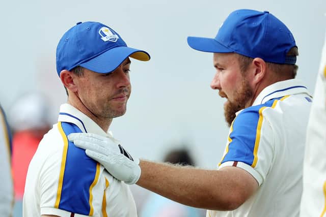 Europe's Shane Lowry hugs team-mate Rory McIlroy. (Photo by Warren Little/Getty Images)