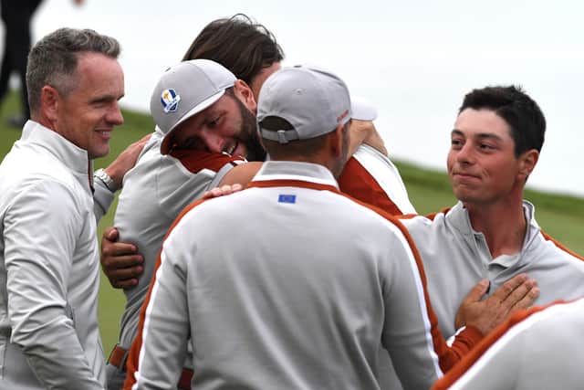 Team Europe's Tommy Fleetwood and Jon Rahm hug, with Sergio Garcia and Viktor Hovland shaking hands after the end of day two at Whistling Straits, Wisconsin. Picture: Anthony Behar/PA