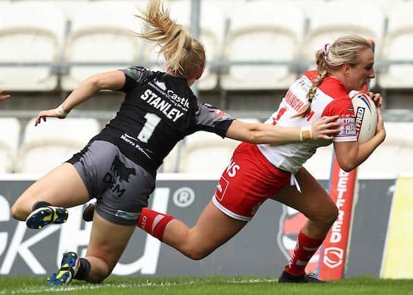 Tara Jane Stanley can't prevent Jodie Cunningham scoring for Saints. Picture by Paul Currie/SWpix.com.