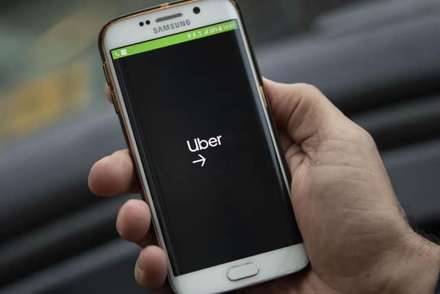 The Uber app.
Photo Illustration by Matthew Horwood/Getty Images