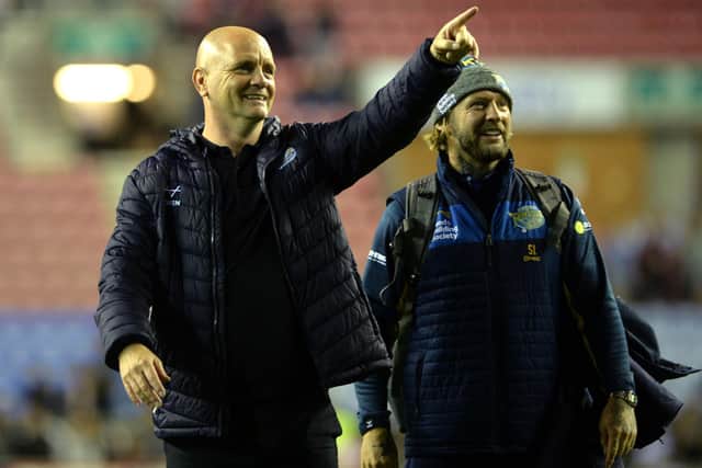Rhinos boss Richard Agar, left and assistant-coach Sean Long celebrate the win at Wigan. Picture by Jonathan Gawthorpe.