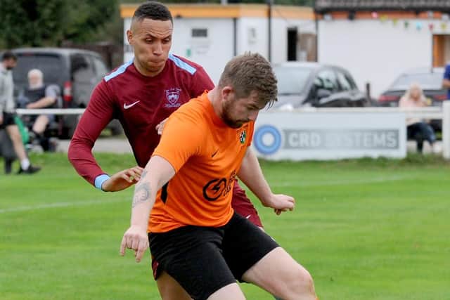 Nat Welsh of East End Park keeps close to Mitchal Lambert-Tuthill of Otley Town. Picture: Steve Riding.