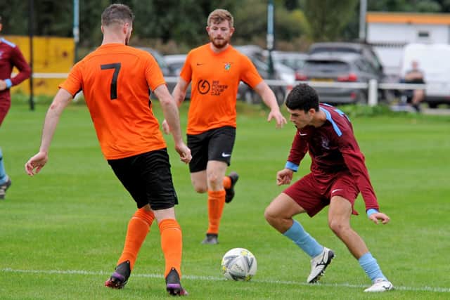 Roi Moskowitz of East End Park looks for a gap against Otley Town in Division One of the West Yorkshire League. Picture: Steve Riding.