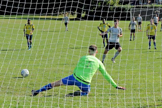 Josh Jepson scores from the penalty spot for North Leodis against Leeds Alpha. Picture: Steve Riding.
