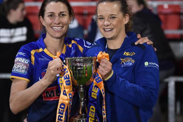 Lois Forsell, right, with captain Courtney Winfield-Hill after Rhinos' 2019 Grand Final win. Picture by Nathan Stirk/Getty Images.
