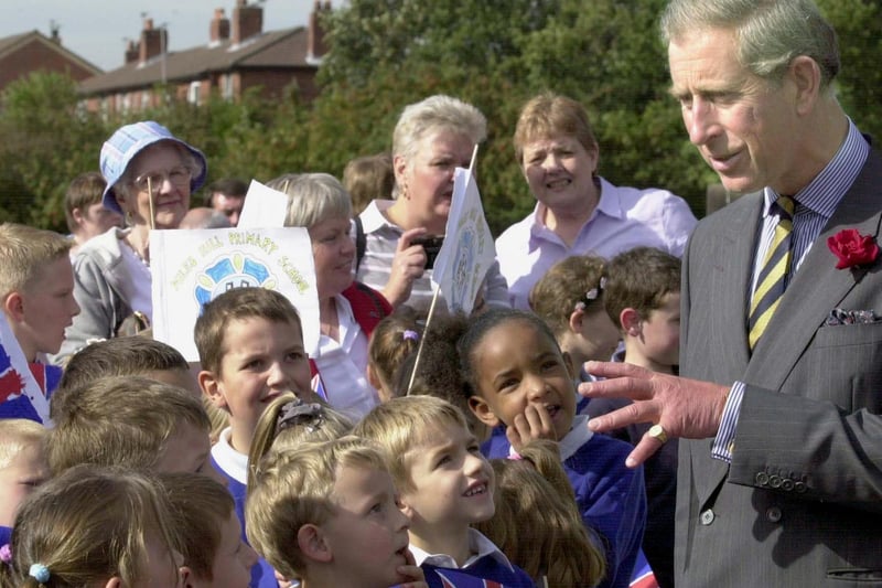 Prince Charles chats to a group of children from Miles Hill Primary School as he arrives at Meanwood Valley Urban Farm.
