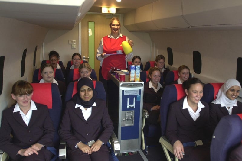 Students in the cabin crew simulator at Park Lane College. Serving drinks is Rachel Cooke.