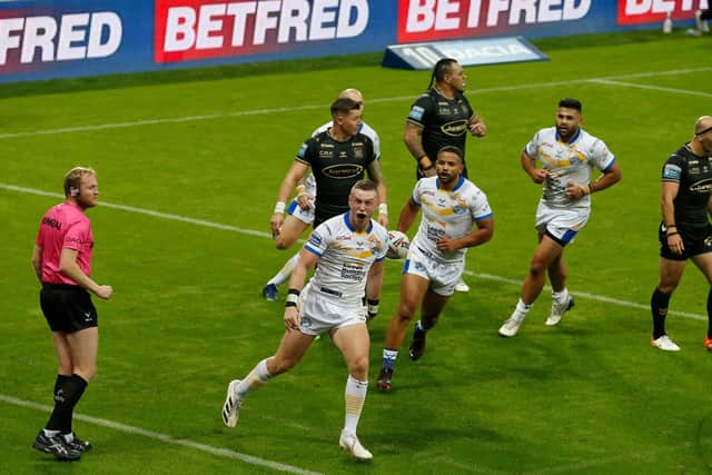 Leeds Rhinos' Harry Newman celebrates scoring a try. Picture by Ed Sykes/SWpix.com.