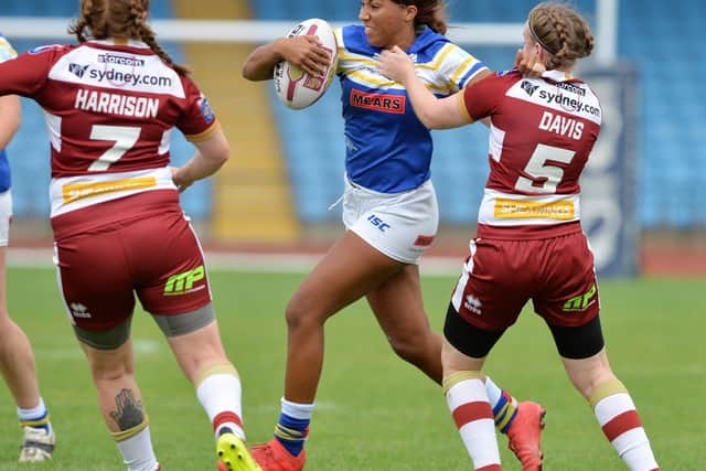Sophie Robinson is tackled during Rhinos' 2018 Grand Final defeat by Wigan. Picture by Bruce Rollinson.