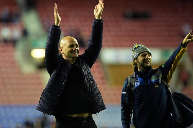 Leeds  Rhinos' head coach Richard Agar and assistant Sean Long salute the fans at Wigan.  Picture: Jonathan Gawthorpe.
