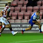 Step closer: Ash Handley scores the crucial try for Leeds Rhinos in their 8-0 Betfred Super League elimination semi-final against Wigan Warriors. Picture: Jonathan Gawthorpe