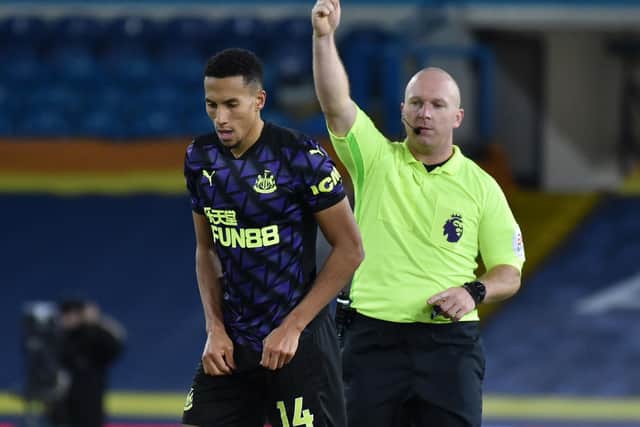 MAN IN THE MIDDLE: Referee Simon Hooper books Newcastle United's Isaac Hayden during last December's 5-2 victory for Leeds United at Elland Road. Photo by RUI VIEIRA/POOL/AFP via Getty Images.