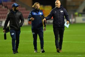 Rhinos coach Richard Agar, right, with assistants Jamie Jones-Buchanan, left and Sean Long before last week's win over Wigan. Picture by Jonathan Gawthorpe.