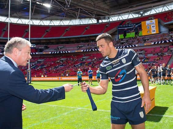 Craig Hall receives his Wembley man of the match medal from RFL chairman Simon Johnson. Picture by Allan McKenzie/SWpix.com.
