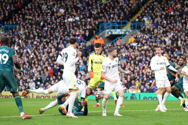 CONTENTIOUS: Watford's Christian Kabasele, grounded, tangles with Leeds United captain Liam Cooper before poking the ball past Illan Meslier after he dropped a corner, only to see the goal disallowed. Photo by Alex Pantling/Getty Images.